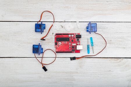  the robot assembly elements.servo, servo motors, printed circuit board, a screwdriverの写真素材