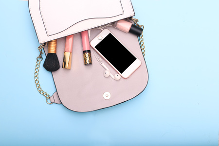 Decorative cosmetics and accessories for makeup on blue backgroundの写真素材