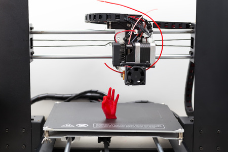Modern 3D printer printing figure close-up. Automatic three dimensional 3d printer performs plastic...
