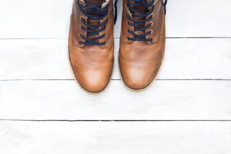 Casual man style leather shoes on white wood background. flat layの写真素材