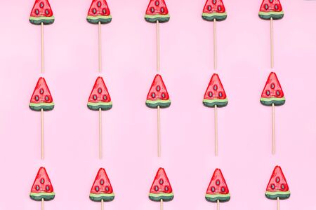 Pattern of slice of watermelon on a pink background. Flat lay