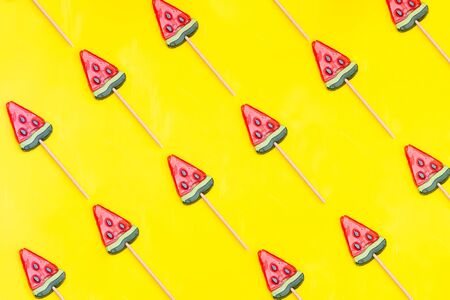 Pattern of slice of watermelon on a yellow background. Flat lay