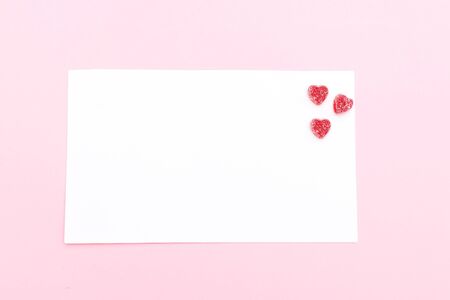 Note with candies in the form of a heart. Valentine's Day