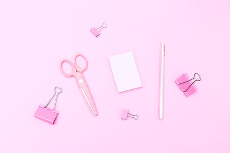 Pink stationery on pasrel background. Flat layの写真素材