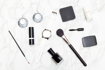 Cosmetics and accessories black and white on a marble background. Flat layの写真素材