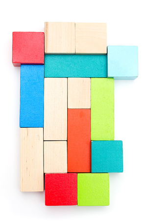 Wooden multicolored blocks on white background. Verticalの写真素材