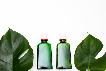 Lavender oil in a glass bottle on a white background. Copy spaceの写真素材