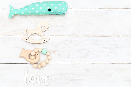 Wooden baby toys and wooden baby teether. Copy space