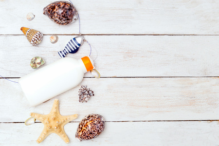 Flat lay composition with sun protection products and seashells. Copy spaceの写真素材