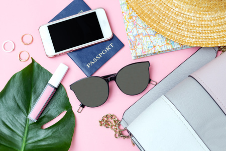 Travel  and fashion feminine accessories on pink background. Flat layの写真素材
