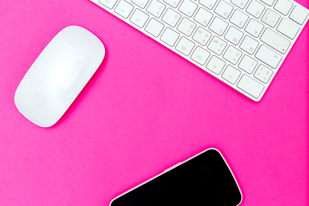 Desk and technology on vivid pink.  Plastic pink colorの写真素材