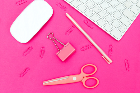 Feminine style desktop. Stationery on pink backgroundの写真素材
