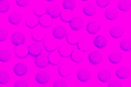 Candy background. Pink round lollipops on a pink backgroundの写真素材
