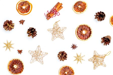 Christmas gold toys and cone on white background. Christmas backgroundの写真素材