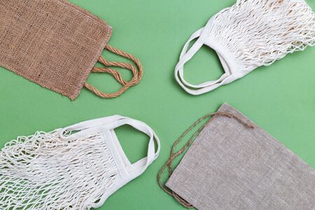 Reusable bags on green background. Zero waste. Flat layの写真素材