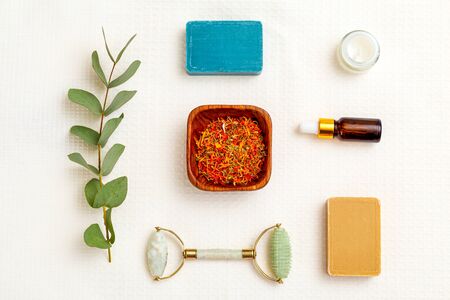 Modern apothecary. dry  marigold herbs and skin care products. Flat layの写真素材