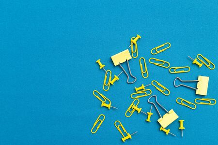 Yellow Stationery on classic blue background. Background. Copy spaceの写真素材