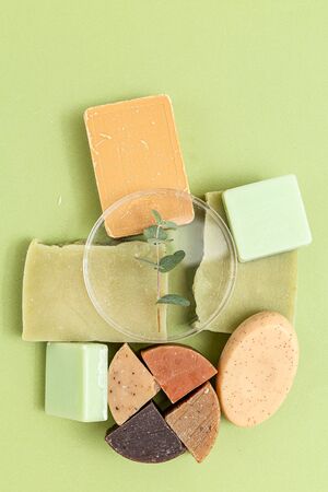 Natural  soap and  eucalyptus on a green background. Vertical format. Organicの写真素材