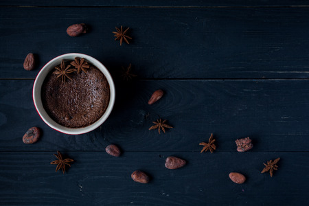 Chocolate fondant, lava cake with cocoa beans on dark background,  close upの写真素材