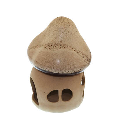 Candle in the form of ceramic house on a white background (isolated).の写真素材