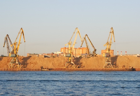 Yellow dock cranes in the river port of Moscowの写真素材