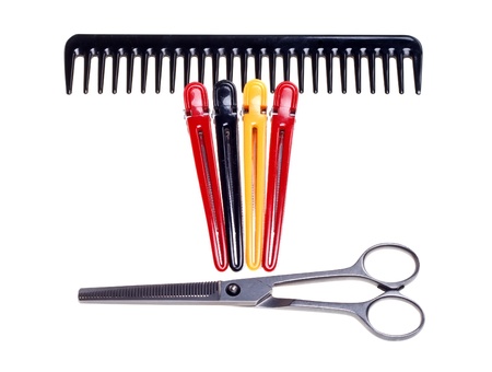 Hairdressing scissors, comb and clips isolated on a white background.の写真素材