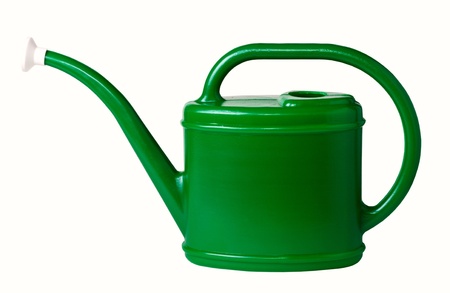Green plastic watering can, isolated on a white background.の写真素材