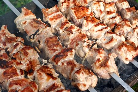 Meat, grilled over charcoal (barbecue over charcoal).の写真素材