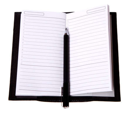 Diary (notebook) and pen isolated on white background.の写真素材