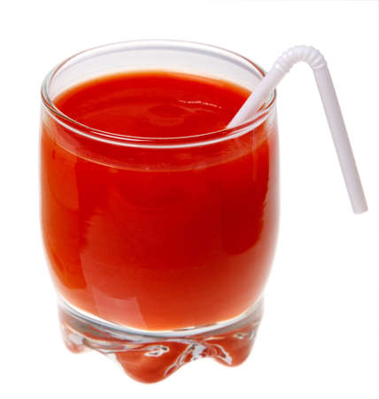 A glass of tomato juice and a straw isolated on a white background.の写真素材