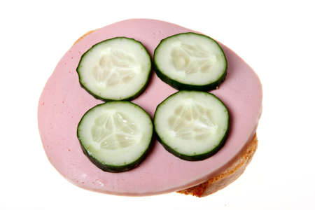 Sandwich with sausage and cucumber isolated on a white background.の写真素材