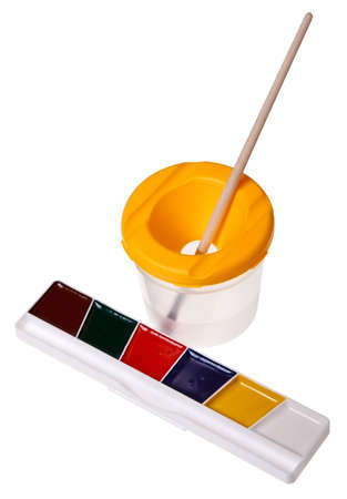 Children's watercolor paints and brushes isolated on a white background.の写真素材