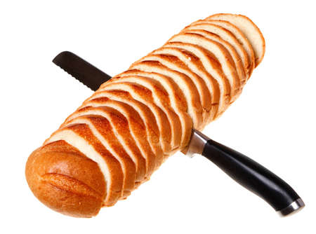 A loaf of bread sliced ??isolated on a white background.の写真素材