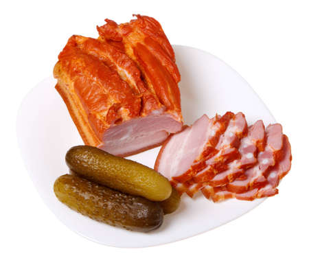 Sliced pork (bacon) and cucumber, isolated on a white background.の写真素材