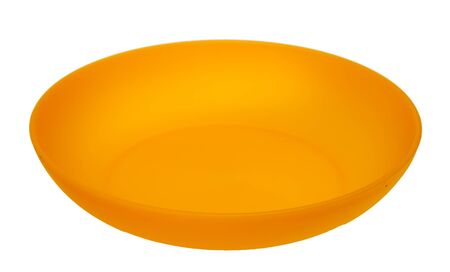 Yellow plastic plate, isolated on a white background の写真素材