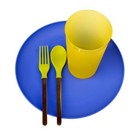 Plastic plate,cup,spoon and fork, isolated on white background  の写真素材