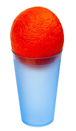 An orange in a blue plastic glass, isolated on a white background の写真素材