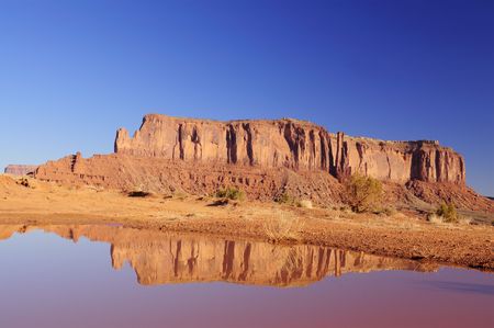 Reflection of the mesa in the pool after autumn rain in Monument Valley, Navajo Nation, Utah.の写真素材