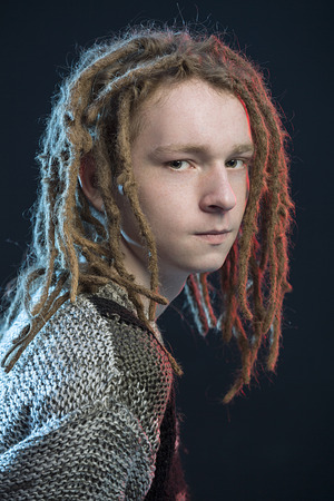 Fashion style guy with dreadlocks, blue red filter effectの写真素材