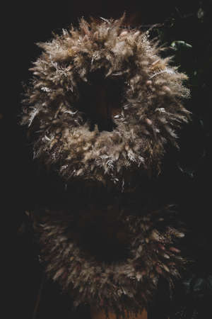 Dried flower bouquet in a florist shop. Low light, film grain.の写真素材