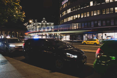 Oslo.Norway-09/18/2020: Architecture near Oslo central station and Karl Johan areas at night. Colorful city lights. Low light photography with long exposure and film grain.のeditorial素材