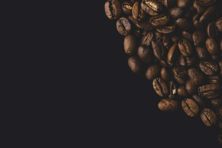 Close-up studio shot of freshly roasted espresso coffee beans.の写真素材