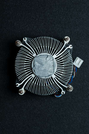 Cpu cooler with old thermal paste. Servicing pc and cleaning old paste.の写真素材