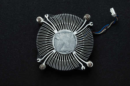 Cpu cooler with old thermal paste. Servicing pc and cleaning old paste.の写真素材