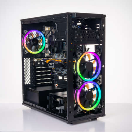 Studio shot of black Gaming desktop pc with rgb lights and visible components. Isolated on white background.の写真素材