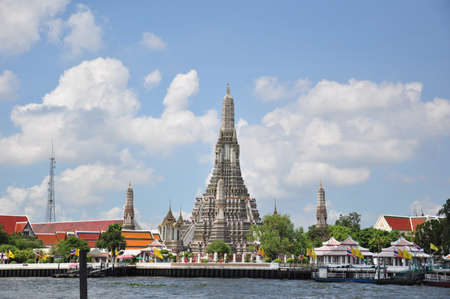 The Temple of Dawn, Wat Arun, on the Chao Phraya river and a beautiful blue sky in Bangkok, Thailand の写真素材