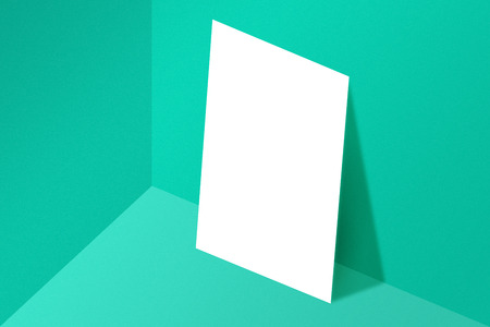Blank A4 paper template on green of background.の写真素材