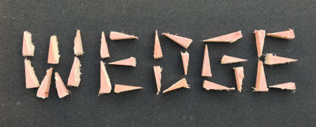 The Word WEDGE Composed of Wooden Wedges