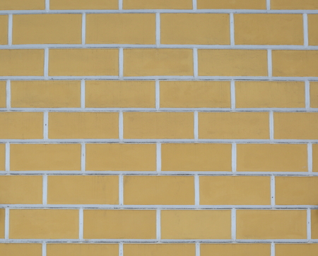White-yellow wall with a large imitation brickの写真素材