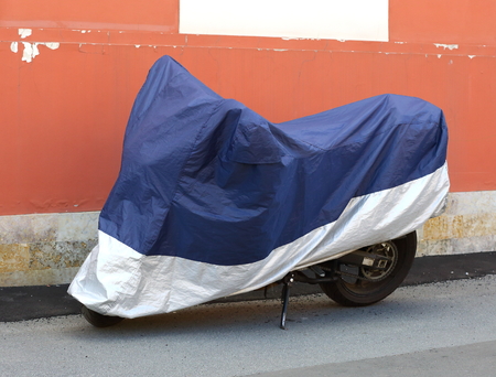 Motorcycle covered with a coverの写真素材